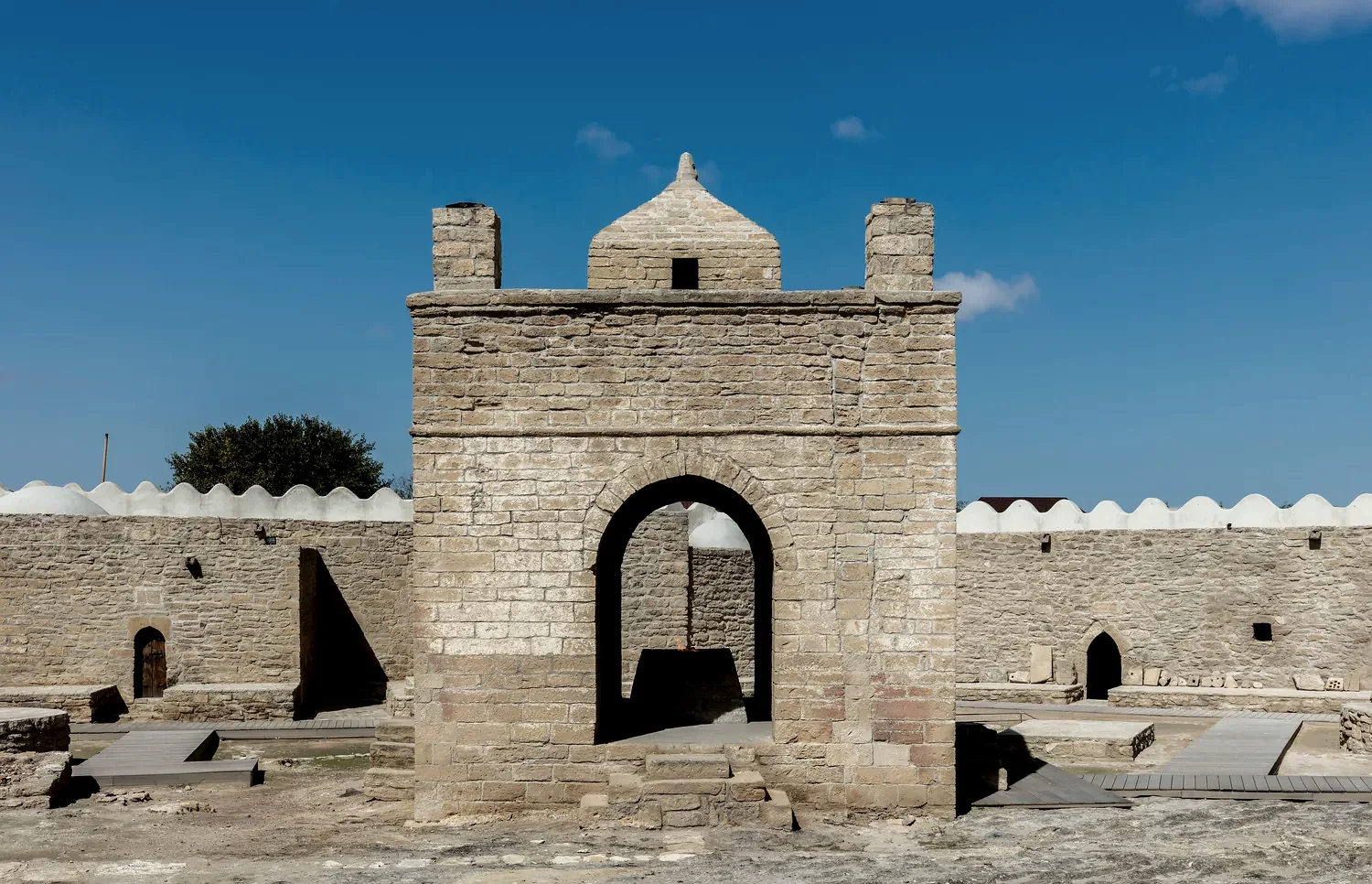 A fire temple built over a vent in the ground.