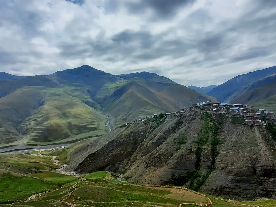 Stone houses stacked up a mountainside at Xinaliq.