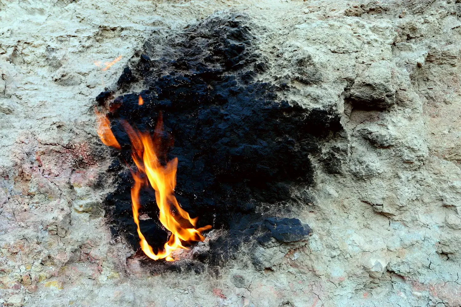The flame at the foot of the hill